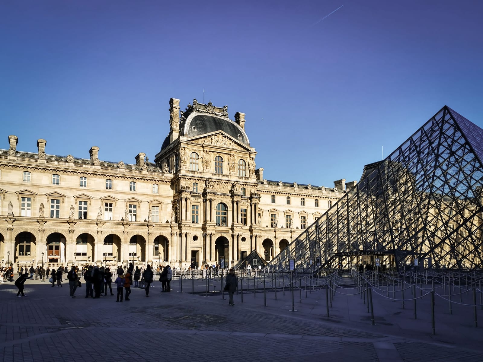 Louvre Museum and glass pyramid in Paris
