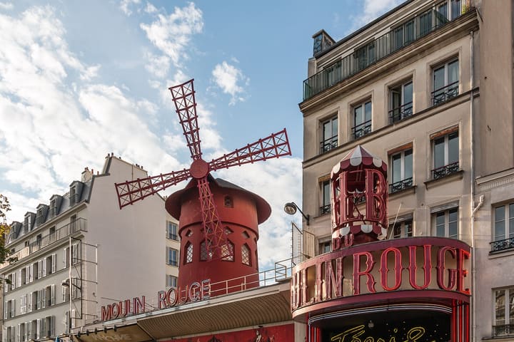 Moulin Rouge and its red windmill on boulevard de Clichy