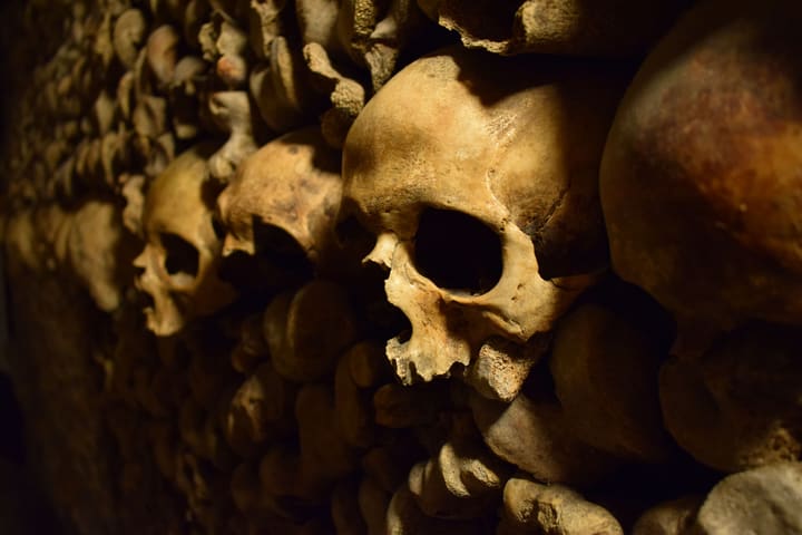 Interior tunnels and ossuary walls inside the Paris Catacombs