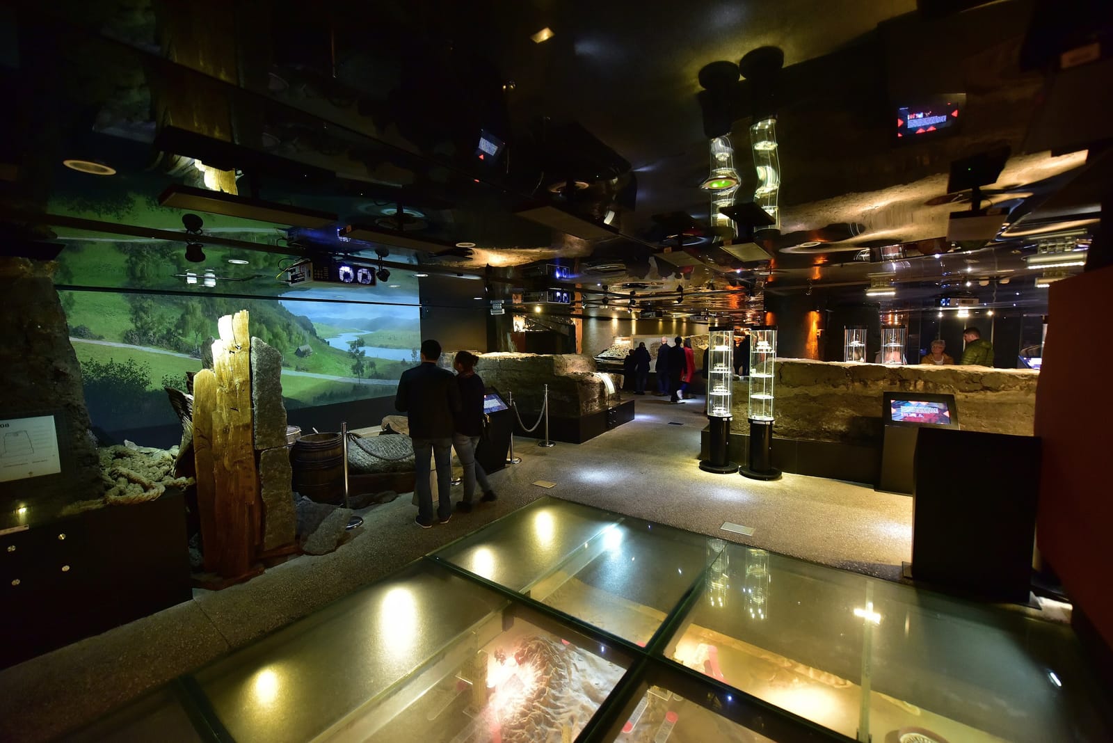 Archaeological displays and a glass floor in the Rynek Underground museum beneath Kraków's Main Market Square