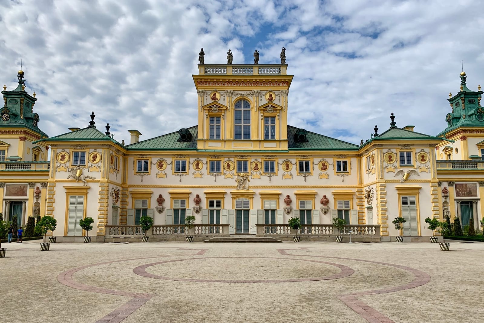 The yellow Baroque facade of Wilanów Palace in Warsaw