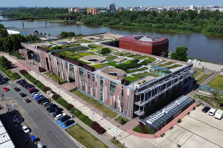 The Copernicus Science Centre and its green roof beside the Vistula in Warsaw, seen from above