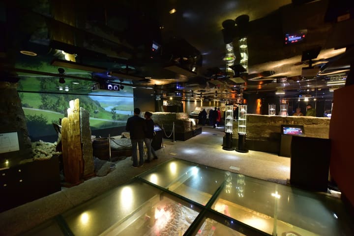 Archaeological displays and a glass floor in the Rynek Underground museum beneath Kraków's Main Market Square