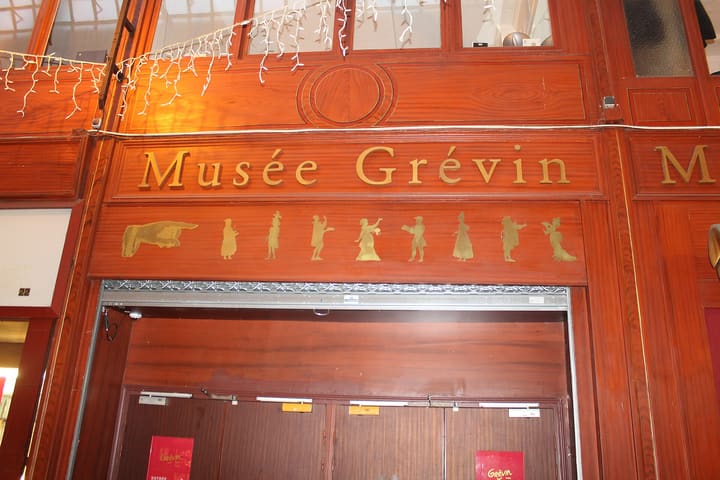 The red and gold Musée Grévin sign