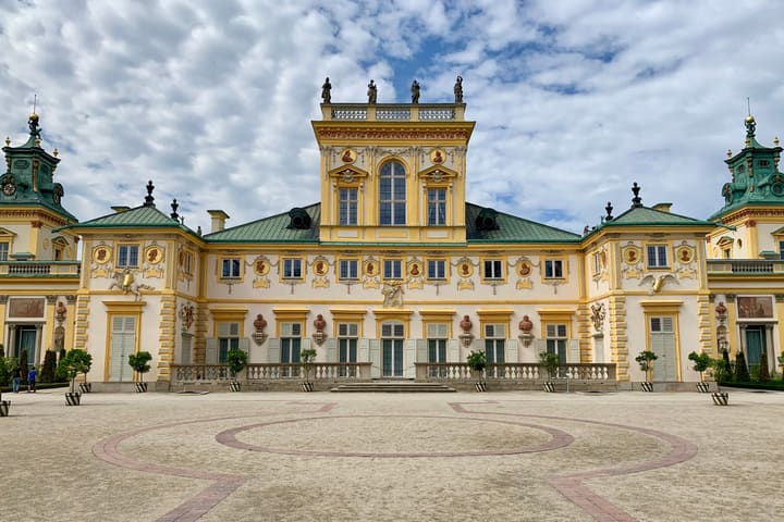 The yellow Baroque facade of Wilanów Palace in Warsaw